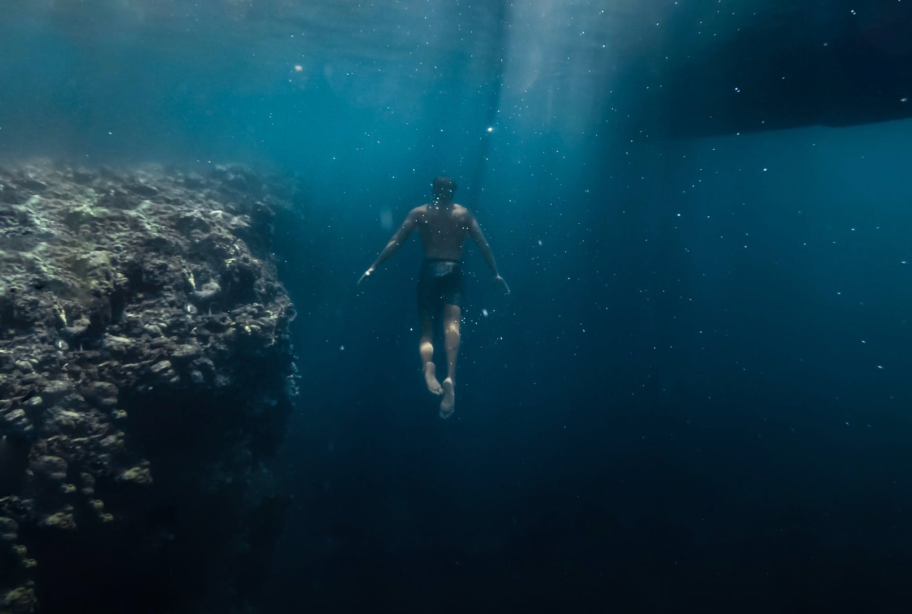 man under body of water