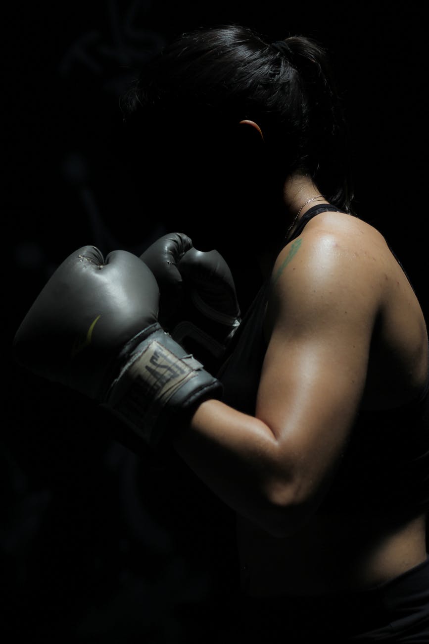 photo of woman in boxing gloves
